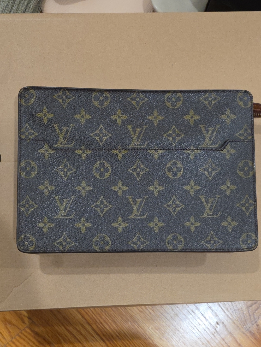 Louis Vuitton
Monogram Pochette Homme. With Organiser And Generic Chain.